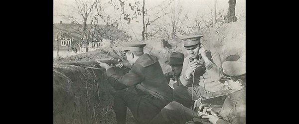 Soldiers in trench with field telephone