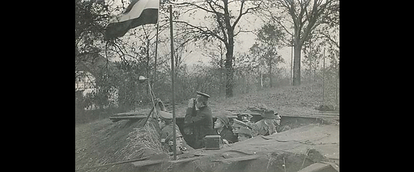 Soldiers with field telephone in defensive fighting position